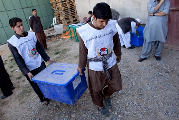 Afghan workers of the Independent Election Commission (IEC) load ballot boxes to be distributed to polling stations. (Photo: Majid Saeedi/Getty Images)