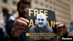 A man attends a rally on May 31 in Tbilisi to support Azerbaijani journalist Afqan Muxtarli, who was reportedly abducted in the Georgian capital on May 29 and is now in detention in Baku.