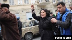 Azerbaijani opposition activist Gozal Bayramli insists that the banknotes were planted in her bag.
