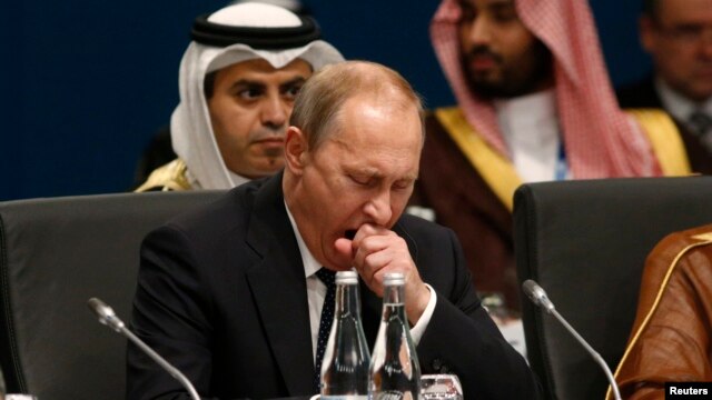 Russian President Vladimir Putin yawns at the start of the plenary session at the G20 summit in Brisbane, Australia, on November 15.