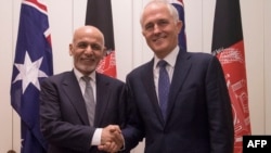 Australian Prime Minister Malcolm Turnbull (right) poses with the visiting Afghan President Ashraf Ghani in Canberra on April 3.