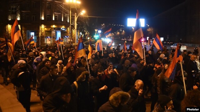 Opposition supporters rally against the results of the constitutional referendum in Yerevan on December 7.