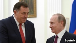 Russian President Vladimir Putin (right) meets with Republika Srpska President Milorad Dodik at the Kremlin in Moscow on September 22. 