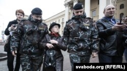 Protesters are detained at a demonstration in front of KGB headquarters in Minsk 'to support arrested patriots' on March 31.