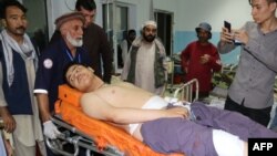 An Afghan victim receives medical treatment after separate suicide bombings at an education center and a wrestling club in a predominantly Shi'ite neighborhood of Kabul earlier this month.