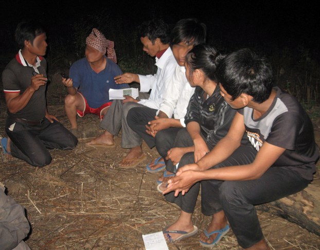 Part of the group of Montagnards in a jungle in Cambodia's Ratanakiri province, Nov. 26, 2014. Some of their faces have been blurred to conceal their identities.