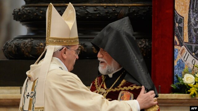 Aram I (right), head of the Catholicosate of the Great House of Cilicia, speaks with Pope Francis during an Armenian-Rite Mass marking 100 years since the mass killings of Armenians under the Ottoman Empire, at St. Peter's basilica in Vatican on April 12.