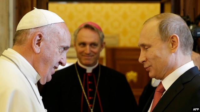Pope Francis (left) meets with Russian President Vladimir Putin on the occasion of a private audience at the Vatican on June 10.