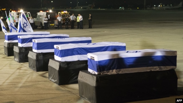 The coffins of five Israelis who were killed during the terror attack on a tour bus in Burgas, Bulgaria, resting at Ben Gurion International Airport near Tel Aviv on July 20.