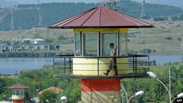 A guard walks on a watchtower at a Georgian prison (file photo)