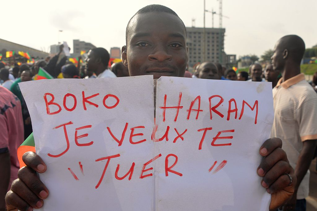 The deadliest attack took place in Waza on 12 July, when 16 civilians were killed and at least 34 injured. A man holds a placard that reads 'Boko Haram, I want to kill you' during a demonstration on February 28, 2015 in Cameroon. Some 10,000 to 15,000 people took part to the march