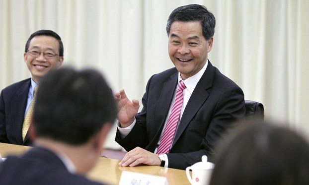Hong Kong Chief Executive C.Y. Leung (R) meets with Hong Kong businessmen in Beijing, April 11, 2012.