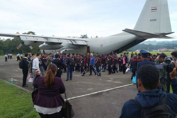 A group of rescued fishermen board a military plane in Ambon airport, in Indonesia's Maluku province during their repatriation, April 9, 2015.