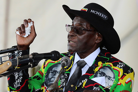 Zimbabwean President Robert Mugabe speaks to supporters gathered to celebrate his 93rd birthday near Bulawayo, February 25, 2017. (Reuters/Philimon Bulawayo)