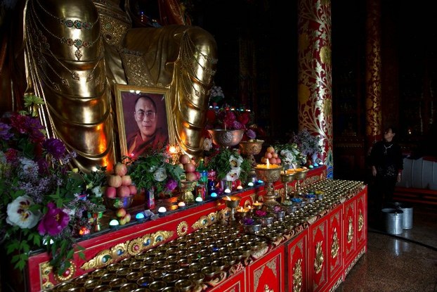 A portrait of the Dalai Lama stands on display at the Rongwo monastery in Qinghai province on May 16, 2013.