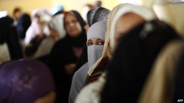 Women at a polling station in central Cairo in December 2012