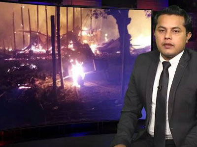 In this screen grab from a YouTube video, Ajmeer Omar presents the news during Wednesday's Rohingya Vision TV broadcast, Jan. 31, 2018.
