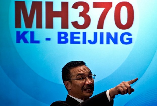Malaysian Minister of Defense and Acting Transport Minister Hishammuddin Hussein answers questions from reporters at a hotel near the Kuala Lumpur International Airport on March 12, 2014.