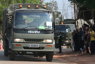 The first Thai military truck carrying Hmong refugees departs for Laos, Dec. 28, 2009.