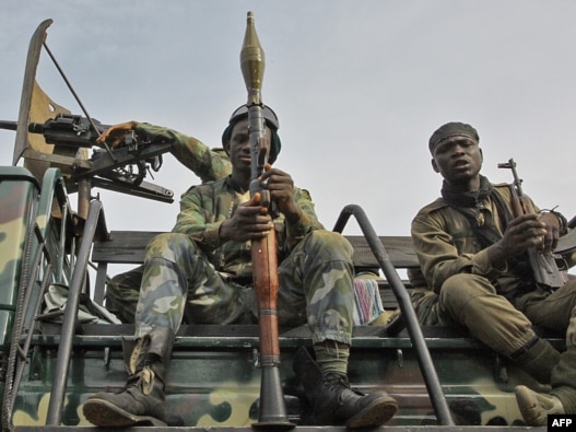Pro-Ouattara fighters prepare for the so-called 'final assault' in Abidjan today.