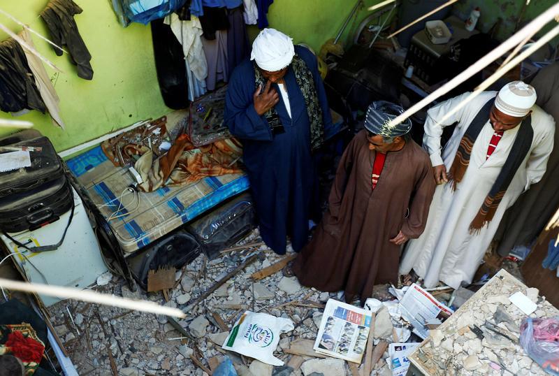 People check the damage created by debris, after ballistic missiles fired by Yemen's Houthi militia, fell at a house in Riyadh, Saudi Arabia, March 26, 2018.