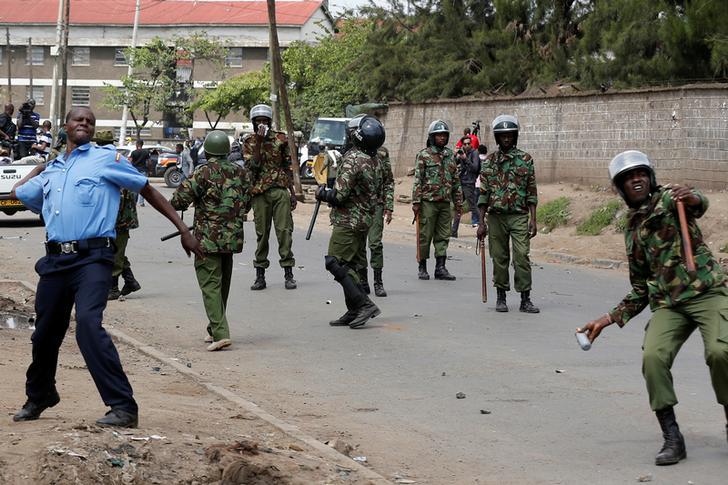 Policemen attempt to disperse supporters of Kenyan opposition leader Raila Odinga of the National Super Alliance (NASA) coalition along Likoni road as they are repulsed from accessing city Centre, in Nairobi, Kenya November 17, 2017.