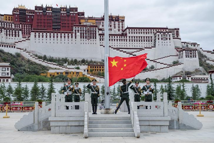 China's national flag is raised during a ceremony marking the 96th anniversary of the founding of the Chinese Communist Party at Potala Palace in Lhasa, Tibet Autonomous Region, China, July 1, 2017.