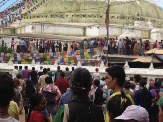 People gather outside the Boudhanath Stupa in Kathmandu after the self-immolation, Aug 6, 2013.