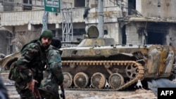 Syrian pro-government forces patrol a district of Aleppo earlier this week.
