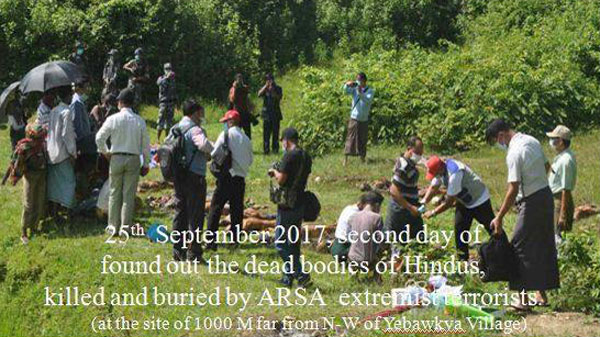 Myanmar authorities examine the bodies of 17 Hindus unearthed from two mass graves in Maungdaw township in Myanmar's northern Rakhine state, Sept. 25, 2017.