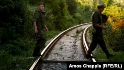 Russian soldiers cross rail tracks in Gudauta, Abkhazia, where a Russian military base is located (file photo).