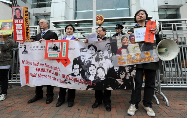 China Human Rights Lawyers Concern Group hold placards of missing, detained or under-house-arrest lawyers in China in a protest in Hong Kong, Jan. 27, 2011.