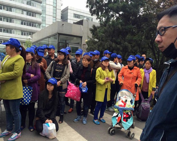 Parents of children affected by tainted vaccines gather in protest outside China's Health and Family Planning Commission in Beijing, April 2016.