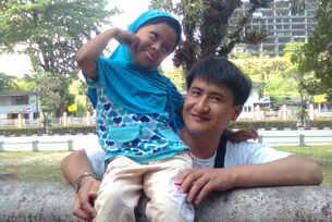 Nur Muhemmed with his daughter in Thailand in an undated photo.