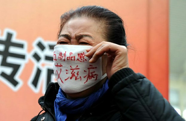 AIDS activist in China's Henan province, center of a 1990s mass infection scandal, mounts a protest, in file photo.