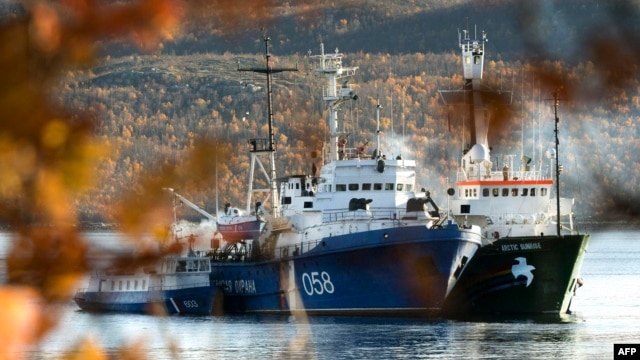 Greenpeace's 'Arctic Sunrise' (right) is moored next to a Russian Coast Guard ship in the northern port of Murmansk.