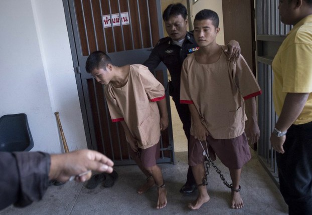 Zaw Lin (left) and Win Zaw Htun are taken from court after hearing their sentences, Koh Samui, Thailand, Dec. 24, 2015.
