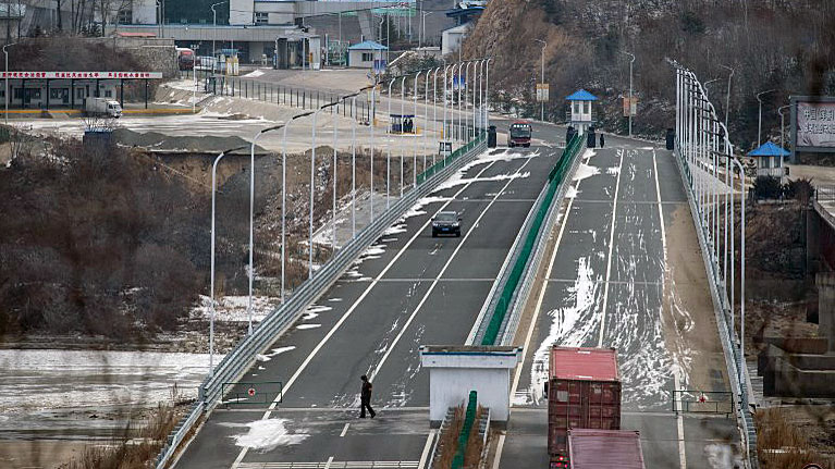 A truck entering the Rason Special Economic Zone makes its way across a bridge marking the border between North Korea (bottom) and China (top), Nov. 21, 2017.