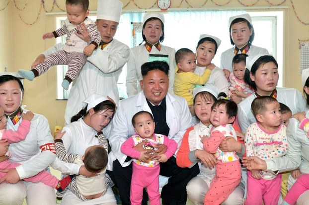This undated picture released by North Korea's official Korean Central News Agency on May 19, 2014 shows Kim Jong Un (C) meeting with children at the Taesongsan General Hospital in Pyongyang.