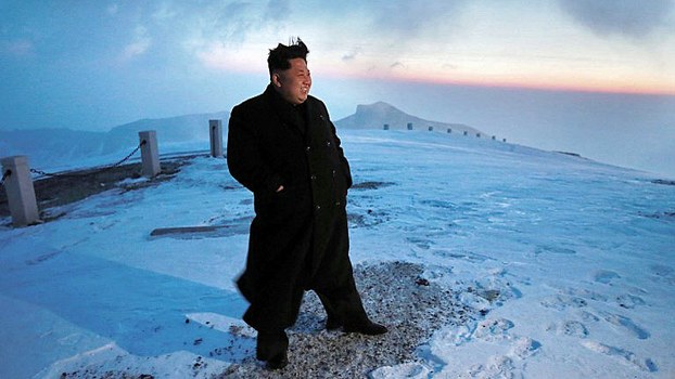 North Korean leader Kim Jong Un stands atop snow-covered Mount Paektu at sunrise in Yanggang province, April 18, 2015.