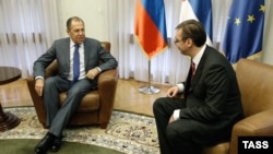 Serbian Prime Minister Aleksandar Vucic (right) meets with Russian Foreign Minister Sergei Lavrov in Belgrade on December 12.