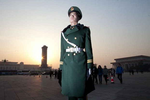 A paramilitary guard stands guard on Tiananmen Square in Beijing, March 5, 2013.
