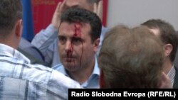 Protesters, among them masked people, attacked deputies after they stormed parliament in Skopje,including Social Democrat leader Zoran Zaev on April 27.