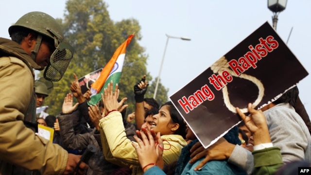 Demonstrators call for better safety for women following the rape of a student in New Delhi in December 2012.