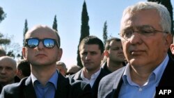 Montenegrin opposition leaders Andrija Mandic (right) and Milan Knezevic attend a protest in front of the parliament building in Podgorica on Februaru 15.