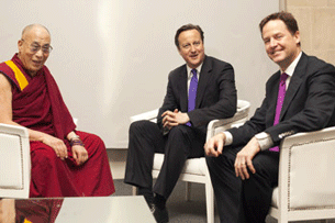 The Dalai Lama meets with British Prime Minister David Cameron (C) and Deputy Prime Minister Nick Clegg (R) at St. Paul's Cathedral in London, May 14, 2012.