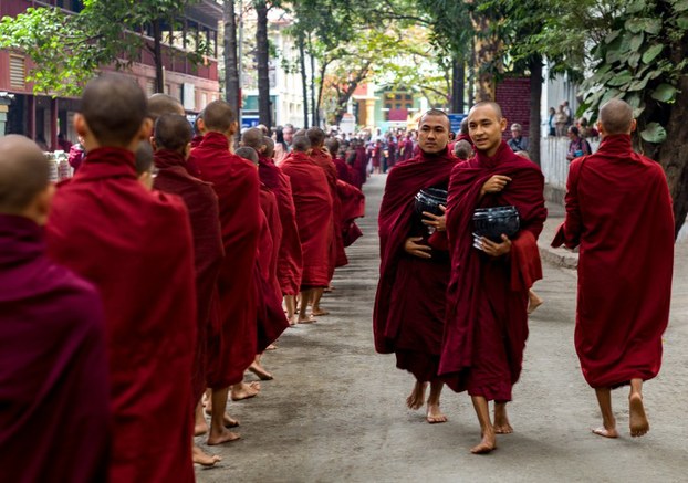 A procession of monks near the Mahagandayon monastery in Mandalay, April 18, 2013.