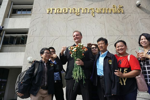 Labor-rights activist Andy Hall (center) gathers with supporters outside the Bangkok South Criminal Court, May 19, 2016.