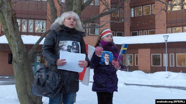 Volha Klaskouskaya (left)protests outside the Belarusian Embassy in Stockholm in January 2011.