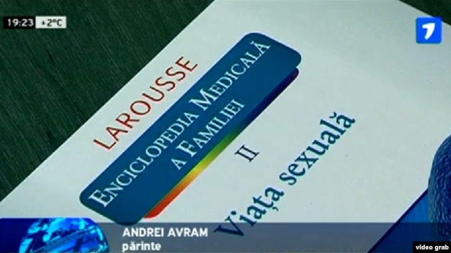 A TV grab shows the cover of a Romanian-language translation of a French reference book titled 'A Family Medical Encyclopedia, Vol. II: Sex Life,' during a press conference in the city of Balti on March 13.